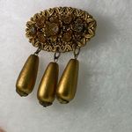 Vintage celluloid float dangle gold tone brooch Photo 1