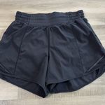 Lululemon  Hotty Hot Short High-Rise Long 4" Women Size 4 Black Photo 0