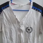 PINK Victoria's Secret tie up lace neckline pink on sleeves short sleeve shirt in white and black size large. Photo 1