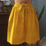Anthropologie  Odille Drawing Parallels Pleated Pocket Skirt in Marigold Yellow Photo 13