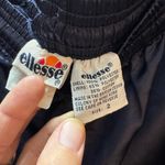 VINTAGE ELLESSE WARM UP TENNIS PANTS SZ 2 NAVY BLUE LINED DRAWSTRING LEG ZIPPERS Photo 1