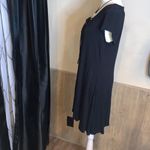 Polly & Esther Boutique purchase from Nashville, TN. Lace up front. Flows, high low hem. Photo 3