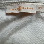 Tory Burch Emily Ruffled Pique Polo Shirt in Ecru. Photo 5