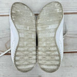 Puma  Carina 2.0 Laser Cut Flowers Sneakers White Gold Logos Athletic Feminine 7 Photo 11