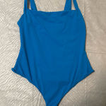  Soft Stretch Bodysuit – Blue SKIMS bodysuit in a bright blue shade. Super soft and stretchy with a smooth, flattering fit. Only worn once and stored in a dresser since. No flaws. Photo 0