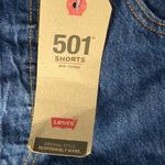 Levi's  mid thigh high rise raw hem jean shorts size 33 Photo 2