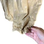 Fabletics  Iggy Jogger Pants Size M/L‎ Tan All-Over Logo Print Sporty Athletic Photo 4