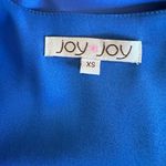 Joy Joy Blue boutique mini dress with pleated skirt and twist front v-neck. Size XS. Photo 5