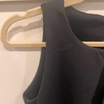 Kendall + Kylie NWT  Black Sleeveless Top with laser cutout at hem. Photo 3