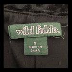 Wild Fable black velvet/sheer mini little black Dress - Size Small. Gently warn & excellent condition. Velvet & sheer appears distorted in pictures but is not. It’s the shine coming off the velvet and is beautiful. Measurements approximately 14” from armpit to armpit x 25” long from chest to bottom. Non-smoking home. priced to sell at as is condition. Don’t like my price, make reasonable offer! And thank you for checking my closet. Photo 4