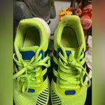 Adidas Neon Green Athletic Shoes with Black Stripes Photo 5