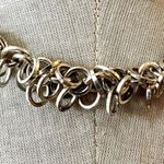 Avon silver tone multi ring necklace Photo 1