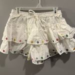 Main Strip  White Colorful Grommet Mini Skort Photo 3