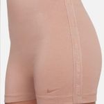 Nike one piece jumpsuit with tape detail in beige Photo 2