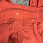 Lululemon  Rise and Flow Pant Mesh Criss Cross Size 4 Orange Coral EUC Photo 10