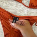 Triangl  bikini set bottoms size medium top size xl but fits a medium  Photo 2