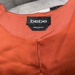 Bebe Orange bodysuit size L Photo 1