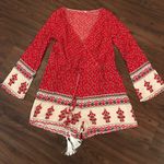 Red and White Patterned Romper Photo 0