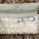 Coach  Silver/Gray and tan signature Turnlock wallet with purple lining Photo 9