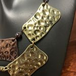 Multi Layered Necklace With Brass, Copper, and Gold Color Hammered Plates Photo 2