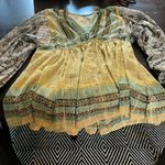 Free People long sleeve blouse in a shear material size medium. GUC. Photo 0