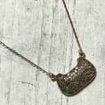 Gold tone long “purse” pendant necklace Photo 0