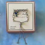 NWT Fine Silver Plated Blue Crystal
Hummingbird Charm Adjustable Bracelet. Photo 1