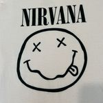 Nirvana  size large fits like a medium light pink short sleeve band T-shirt EUC Photo 2