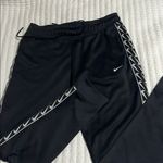 Nike Black Athletic Pants with White Logo Photo 0