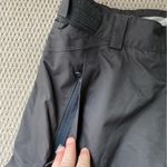 Helly Hansen  medium insulated dark grey snow pants. Adjustable waist and pockets Photo 6
