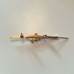 Vintage 1970s gold tone feminine bar brooch with red stones Photo 4