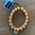Juicy Couture  Stretch Orange Beaded Charm Bracelet with Dangling Heart Charm Photo 0