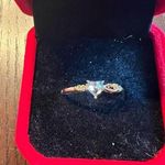 Dainty White Gold Diamond Ring with Accent Stones Photo 0