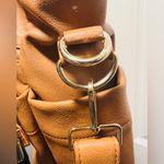 Brown patent leather diaper bag with multiple pockets and key holders Photo 5