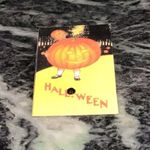 Vintage Halloween girl holding pumpkin pin Yellow Photo 1