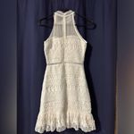 Gorgeous white lace dress. Zipper up back, halter neckline. Size XS Photo 1