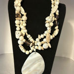 Chico's Chico’s absolutely gorgeous shell necklace. There’s a huge shell pendant. Photo 0