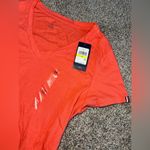 Tommy Hilfiger women’s peach/orange short sleeve T-shirt size (M) new with tag. Photo 1