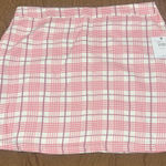 O'Neill Chic mini skirt with pink and white plaid pattern. Perfect for casual outings. Photo 0