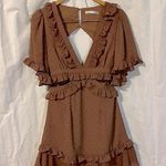 Saints + Secrets ‘Swiss Dot’ Ruffle Dress with Side Cut Outs and Deep Vneck Photo 0