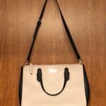 Kate Spade Cream and Black Large Leather Satchel Handbag with Crossbody Strap. Photo 2