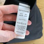 Pretty Little Thing Bandeau Zip Front Crop Top in Black Photo 2