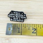 Well Apparently Rock Bottom Has A Basement Enamel Pin Black Photo 3