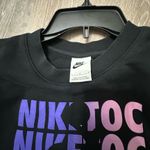 Nike  long sleeve sweatshirt Bold multicolor graphic on front. Comfortable crewneck design. Perfect for casual wear. Photo 2