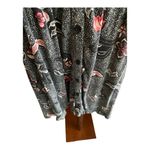 Torrid -WOMENS BABYDOLL TOP-SIZE 1X Black with pink and white flowers, has stretch, buttons down the front, short sleeves, 95% rayon 5% spandex, excellent condition Measurements: Bust: armpit to armpit 24 inches Length: shoulder seam to bottom Front: 29 inches Back: 32 inches Photo 2