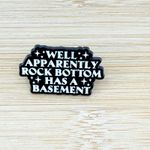 Well Apparently Rock Bottom Has A Basement Enamel Pin Black Photo 1