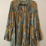 Free People  So Fine Smocked Blue Floral Butterfly Flowy Blouse Women size Medium Photo 0