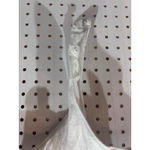 Free People  White Ribbed Knit Short Sleeve Bodysuit Snap Closure Cutout Sides Photo 1