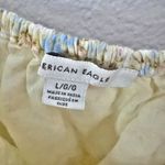 American Eagle  OUTFITTERS | Yellow Floral Print Smocked Cropped Blouse | Large Photo 1