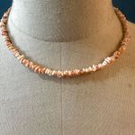 Puka orange shell necklace Photo 1